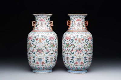 A pair of Chinese famille rose vases with floral design, Jiaqing mark, 19/20th C.