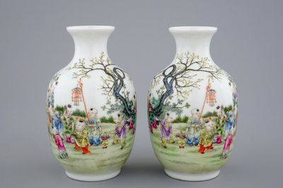 A pair of Chinese famille rose vases with playing boys, 20th C.