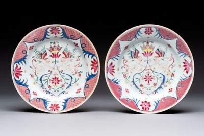 A pair of Chinese famille rose 'winged putti' plates, Yongzheng/Qianlong