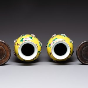 A pair of Chinese famille rose yellow-ground relief-decorated vases with wooden stands, 19th C. — photo 5