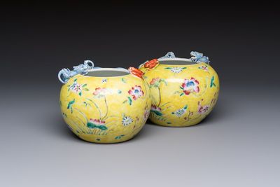 A pair of Chinese famille rose yellow-ground water pots with floral design and applied chilong and bats, Qianlong mark, 19/20th C.