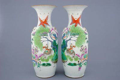 A pair of Chinese famille roses vases with boys on oxes, 19/20th C.