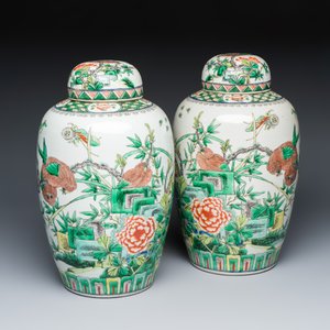 A pair of Chinese famille verte 'Birds among Flowering Branches' vases and covers — photo 1