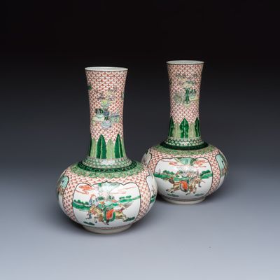 A pair of Chinese famille verte bottle vases with narrative design, 19th C.