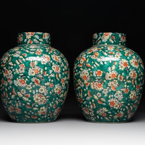 A pair of Chinese famille verte green-ground 'prunus' jars and covers, 19th C. — photo 1