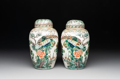 A pair of Chinese famille verte 'pheasant among flowering branches' vases and covers, 19th C.