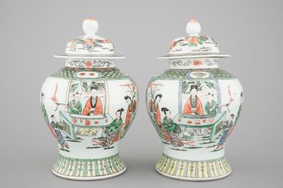 A pair of Chinese famille verte porcelain baluster vases and covers, 19th C.