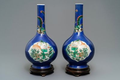 A pair of Chinese famille verte powder blue-ground bottle vases, 19th C.