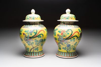 A pair of Chinese famille verte yellow-ground 'pheasants and peonies' vases and covers, 19th C.