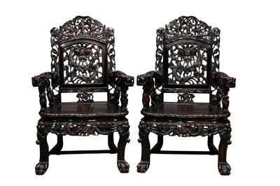 A pair of Chinese finely carved hongmu armchairs, Canton, 19th C.