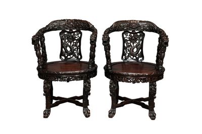 A pair of Chinese finely carved hongmu swivel chairs, Canton, 19th C.