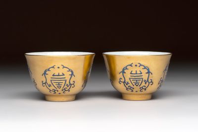A pair of Chinese gilt-and blue-enamelled 'shou 壽' cups, Daoguang mark and possibly of the period