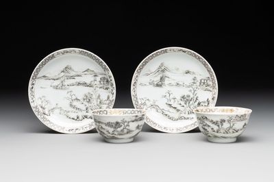 A pair of Chinese grisaille and iron-red 'landscape' cups and saucers, Yongzheng/Qianlong