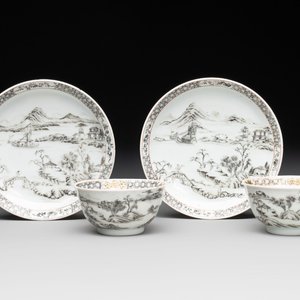 A pair of Chinese grisaille and iron-red 'landscape' cups and saucers, Yongzheng/Qianlong — photo 1