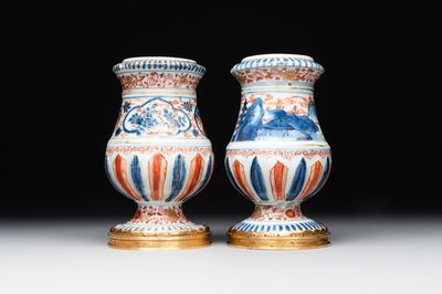 A pair of Chinese Imari-style casters or vases with gilt bronze mounts, Kangxi
