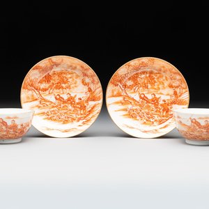 A pair of Chinese iron-red-decorated 'deer hunting' cups and saucers, Qianlong — photo 1