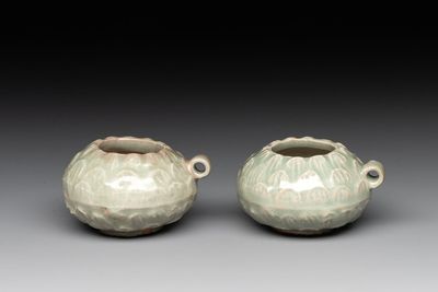 A pair of Chinese Longquan celadon bird feeders, Song