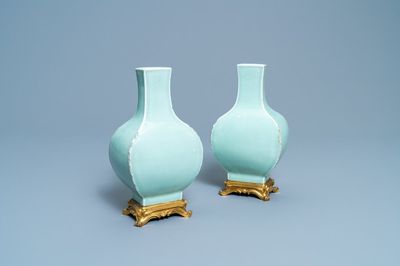 A pair of Chinese monochrome celadon vases with gilt bronze mounts, 18/19th C.