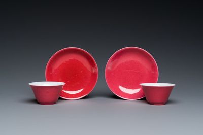 A pair of Chinese monochrome puce-glazed cups and saucers, 19/20th C.