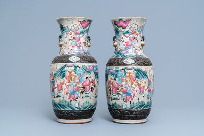 A pair of Chinese Nanking famille rose crackle-glazed 'warrior' vases, 19th C.