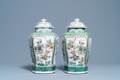 A pair of Chinese octagonal famille verte vases and covers, 19th C.