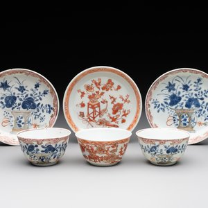 A pair of Chinese polychrome-decorated cups and saucers and an iron-red gilt-decorated cup and saucer, Yongzheng/Qianlong — photo 1