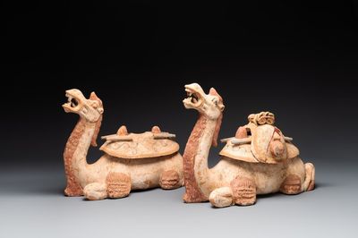 A pair of Chinese polychrome-painted terracotta camels with saddles, Tang