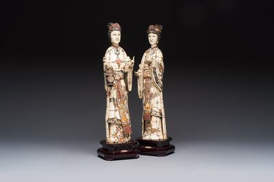 A pair of Chinese polychromed carved bone figures of divinities, 20th C.