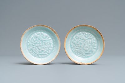 A pair of Chinese qingbai moulded saucer dishes, Song