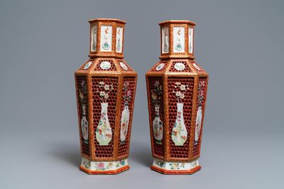 A pair of Chinese reticulated double-walled hexagonal famille rose vases, Yongzheng