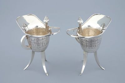 A pair of Chinese silver archaic "Jue" wine cups marked for Heng Li, Tientsin, 19th C.