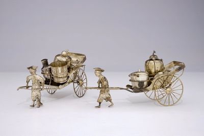 A pair of Chinese silver rickshaw-shaped pepper and salt shakers with a mustard container, 19th C.