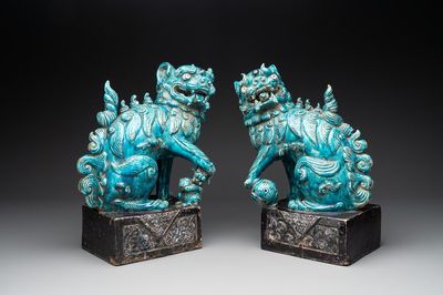 A pair of Chinese turquoise-and-aubergine-glazed Buddhist lions, probably Swatow kilns, 19th C.