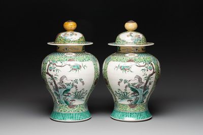 A pair of Chinese verte-biscuit 'cranes and flowers' vases and covers, 19th C.