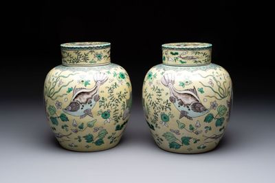 A pair of Chinese verte biscuit 'fish' jars and covers, 19th C.