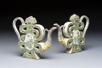 A pair of Chinese verte biscuit 'Shou' wine ewers, 19th C.