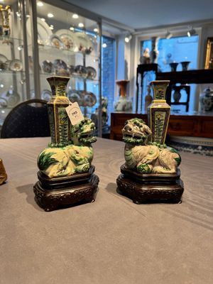 A pair of Chinese verte biscuit vases resting on Buddhist lions, Kangxi — photo 1