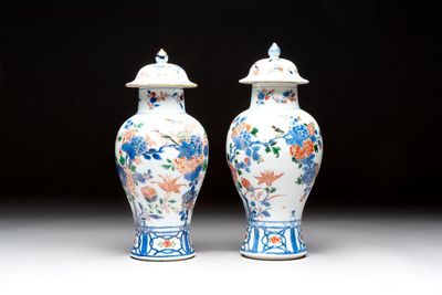 A pair of Chinese verte-Imari 'birds among flowering branches' vases and covers, Kangxi