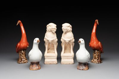 A pair of Chinese white-glazed Buddhist lions, a pair of doves and a pair of iron-red-decorated cranes, Ming and later