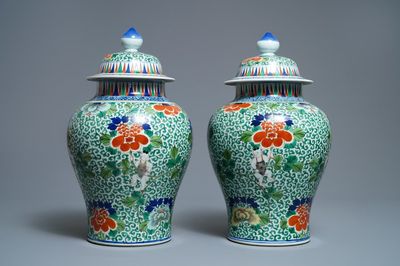 A pair of Chinese wucai vases and covers, Wanli mark, 19th C.