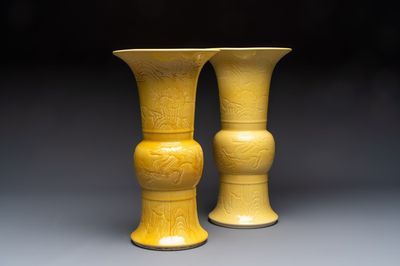A pair of Chinese yellow-glazed 'Gu' vases with incised chilongs and landscapes, Chenghua mark, 20th C.