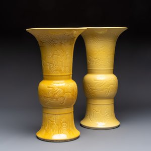 A pair of Chinese yellow-glazed 'Gu' vases with incised chilongs and landscapes, Chenghua mark, 20th C. — photo 1