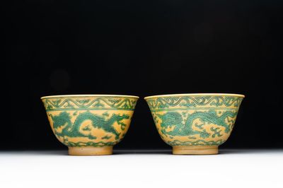 A pair of Chinese yellow-ground 'dragon' and 'shou' bowls, Guangxu mark and of the period