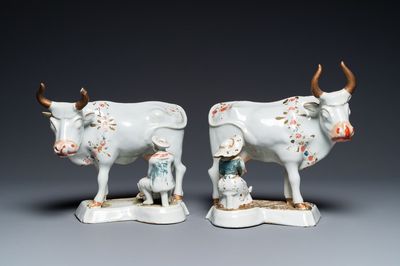 A pair of cold-painted white Dutch Delft cow milkers groups, 18th C.