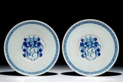 A pair of Dutch Delft blue and white armorial plates, 17th C.