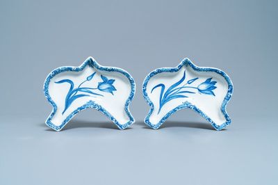 A pair of Dutch Delft blue and white carnation flower dishes, 18th C