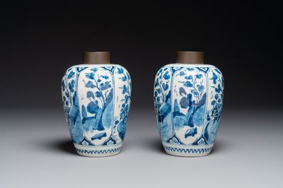 A pair of Dutch Delft blue and white chinoiserie vases with wooden covers, 18th C.