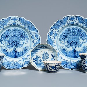 A pair of Dutch Delft blue and white plates, three cups and a saucer, 18th C. — photo 1