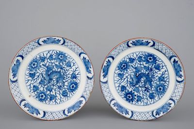 A pair of Dutch Delft blue and white plates with a chinoiserie design of dragons, 18th C.