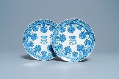 A pair of Dutch Delft blue and white plates with crowned monograms, 1st quarter 18th C.